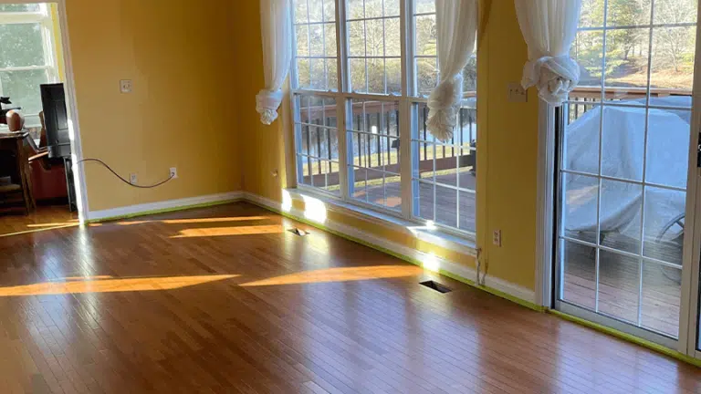 The engineered hardwood floor in a residential living space after a successful glazing by ReCoat Revolution for a satisfied customer.