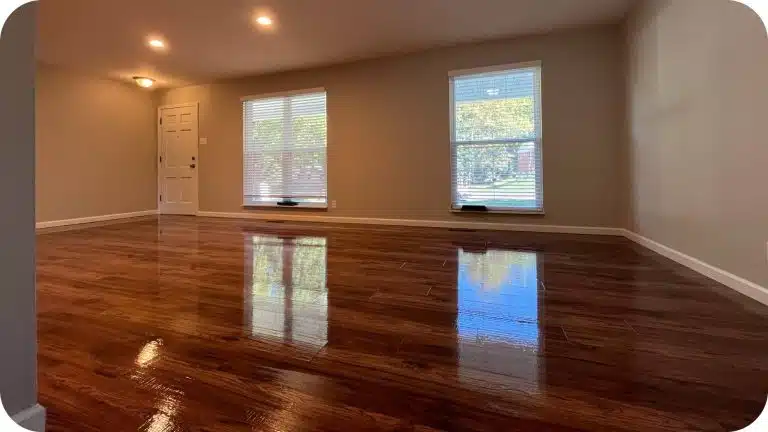 The beautiful, glossy hardwood floor within a residential home completed wax-free for a happy customer by ReCoat Revolution.