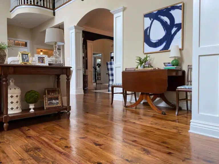 An image showcasing the hardwood flooring of the Coomes residence after refinishing work has been completed by ReCoat Revolution.
