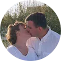 Image of satisfied ReCoat Revolution customers, Rick & Amelia Timms, kissing.