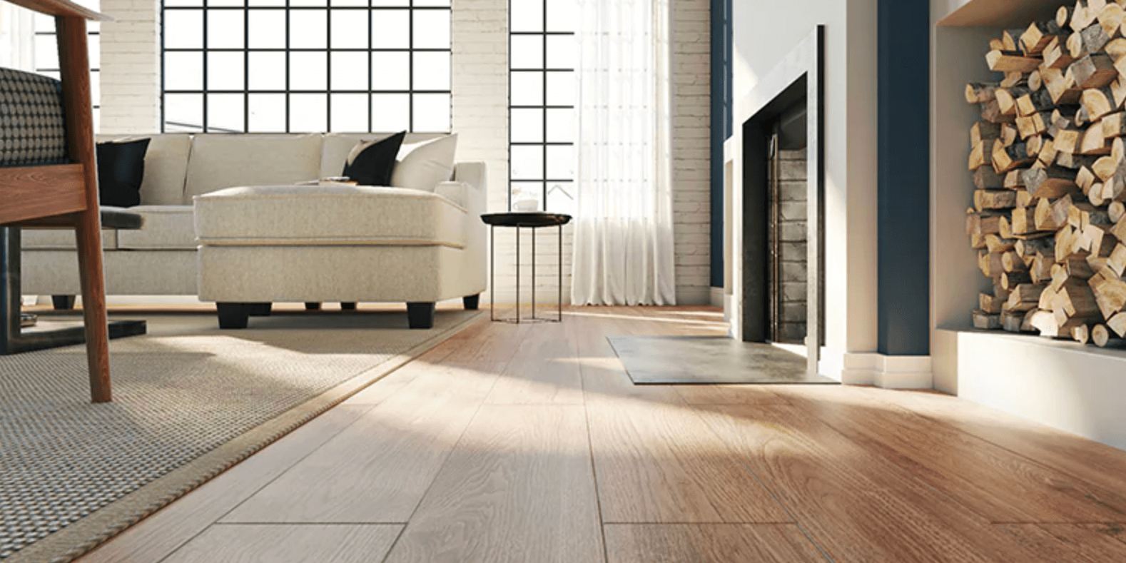 A floor-level view of a modern living space with laminate wood flooring that can be refinished by ReCoat Revolution.